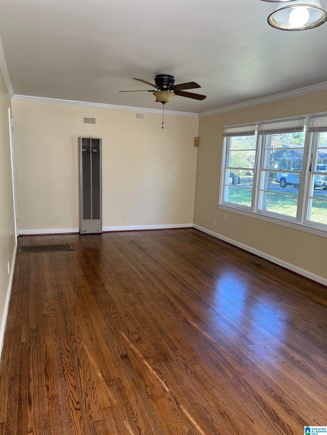 spare room featuring ceiling fan, crown molding, and dark wood-type flooring