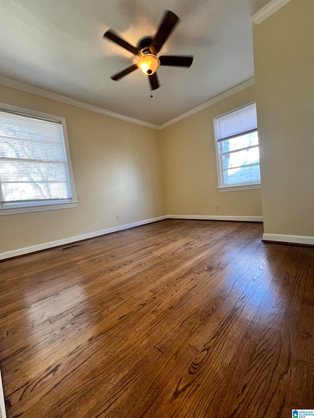 unfurnished room featuring ceiling fan, hardwood / wood-style floors, and ornamental molding