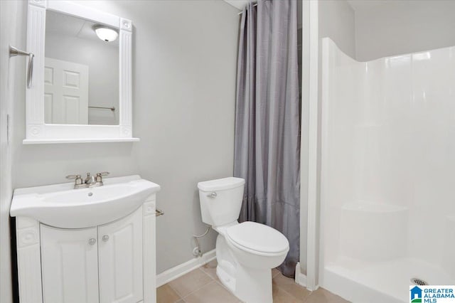 bathroom with tile patterned flooring, a shower with curtain, toilet, and vanity