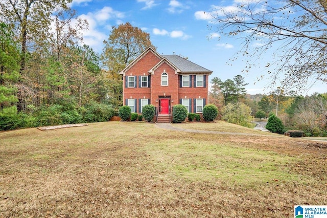 colonial inspired home with a front lawn