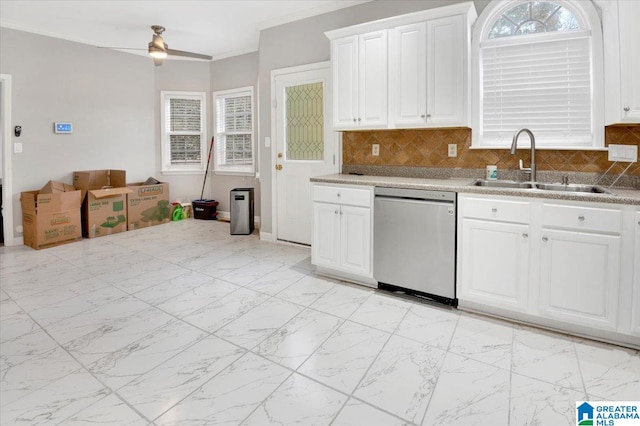 kitchen featuring dishwasher, ornamental molding, sink, and tasteful backsplash