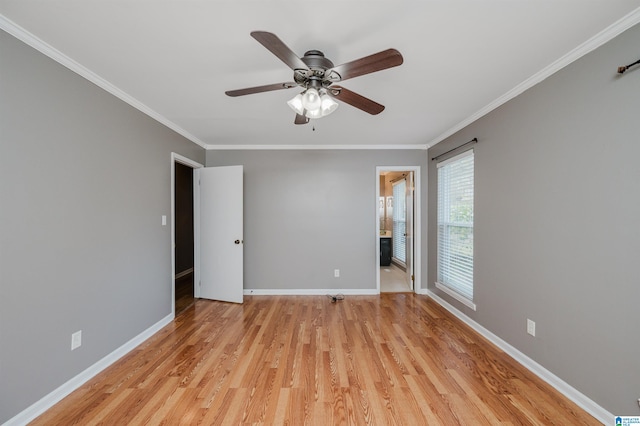 spare room featuring ceiling fan, light hardwood / wood-style flooring, and ornamental molding