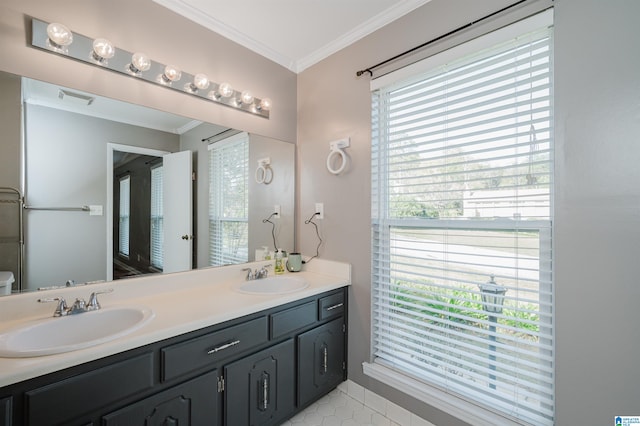 bathroom featuring tile patterned floors, crown molding, vanity, and toilet