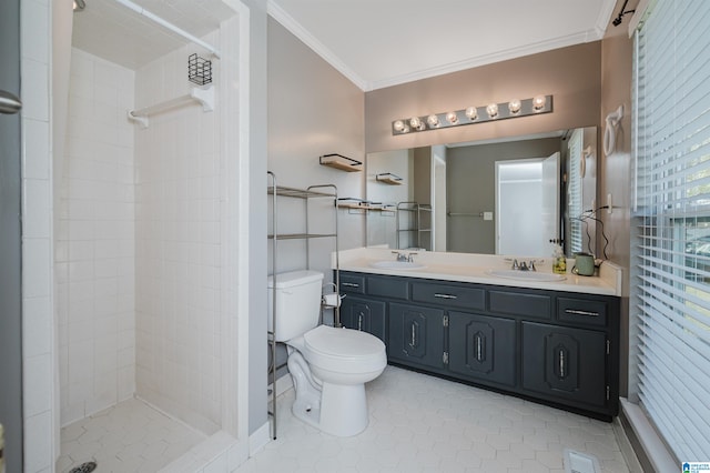 bathroom featuring a tile shower, tile patterned floors, toilet, vanity, and ornamental molding