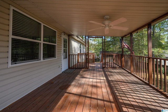 wooden terrace featuring ceiling fan