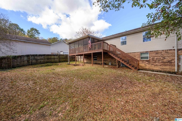 rear view of property with a wooden deck