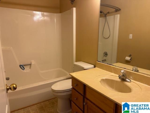 full bathroom with bathtub / shower combination, toilet, and vanity