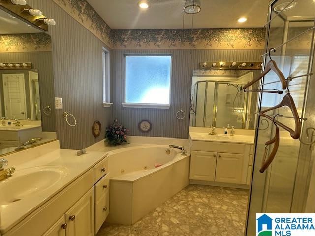 bathroom with vanity and plus walk in shower