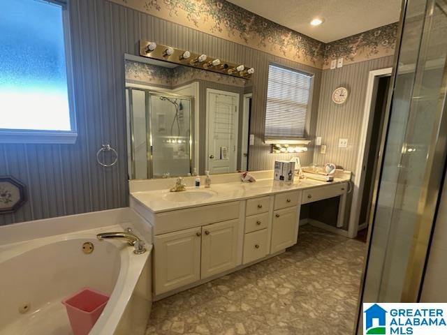 bathroom with vanity and plus walk in shower