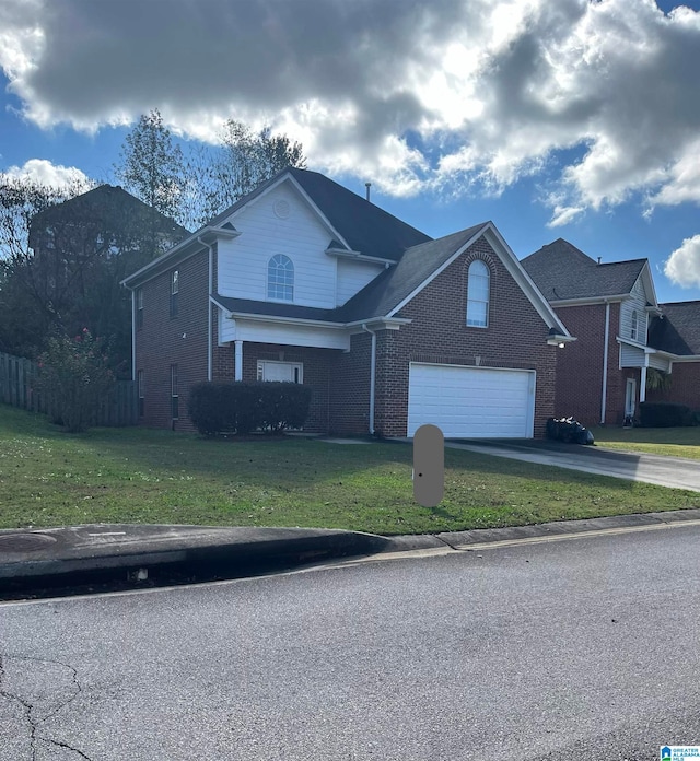 front of property with a front yard and a garage