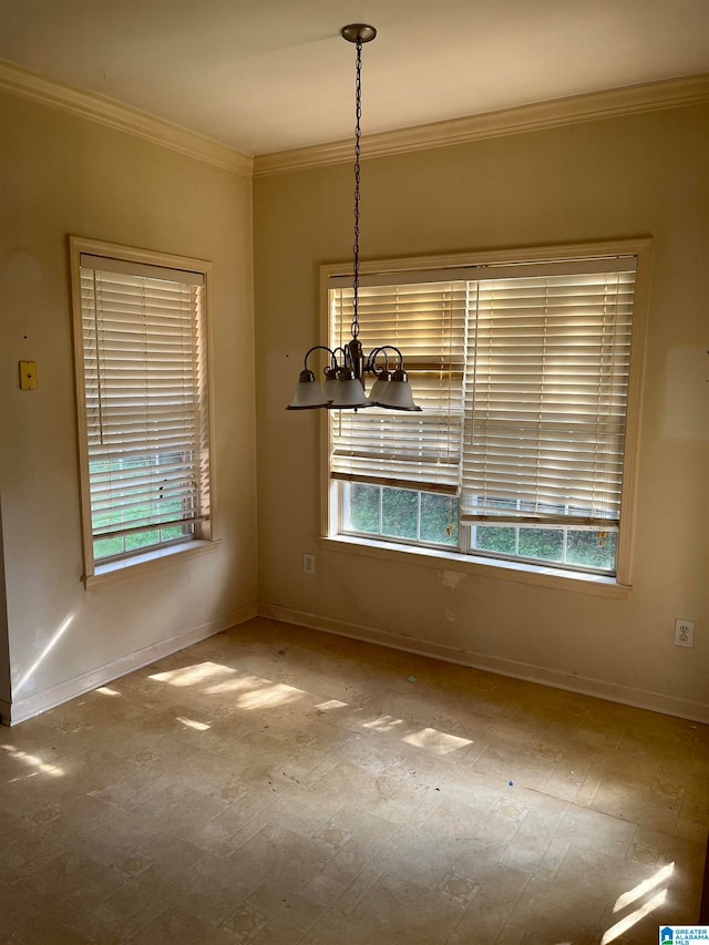 unfurnished dining area with crown molding and a notable chandelier