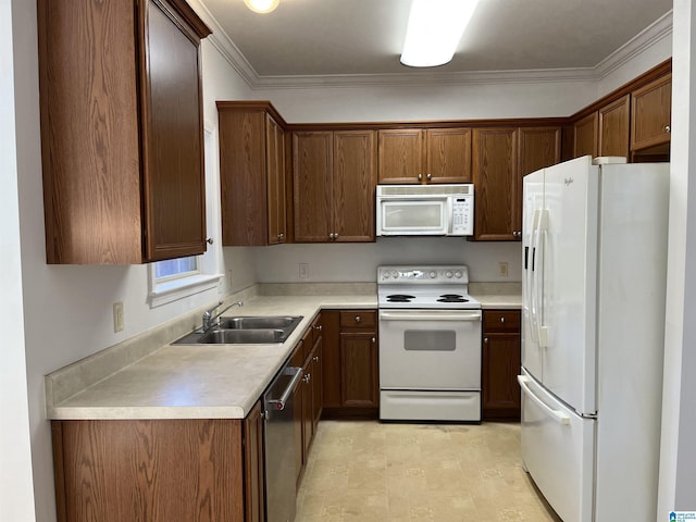 kitchen featuring sink, white appliances, and ornamental molding