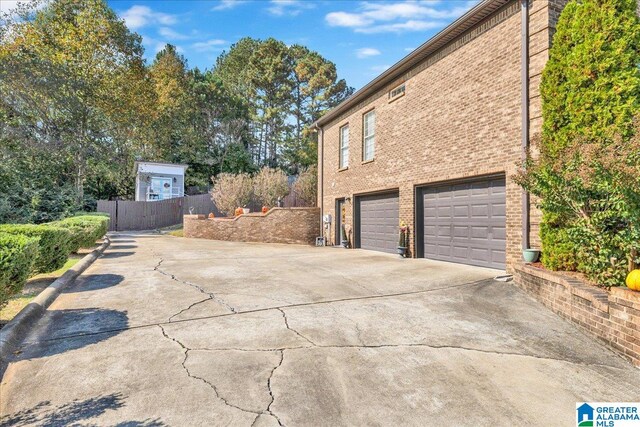 view of side of home with a garage