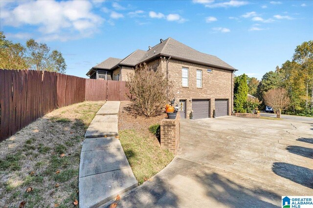 view of side of home with a garage