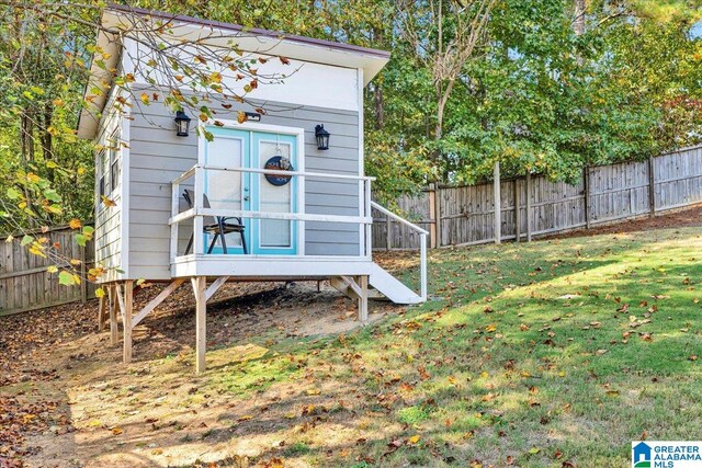 view of outbuilding with a yard