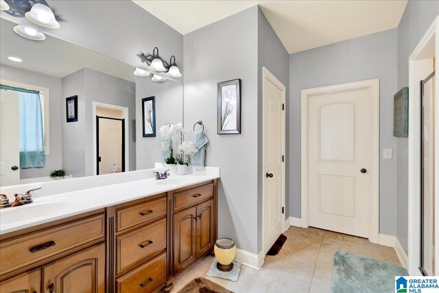 bathroom featuring tile patterned flooring and vanity