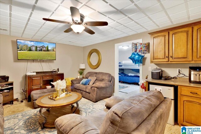 living room with light carpet and ceiling fan