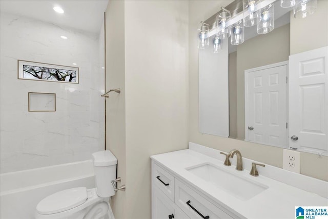 full bathroom featuring vanity, toilet, and tiled shower / bath combo