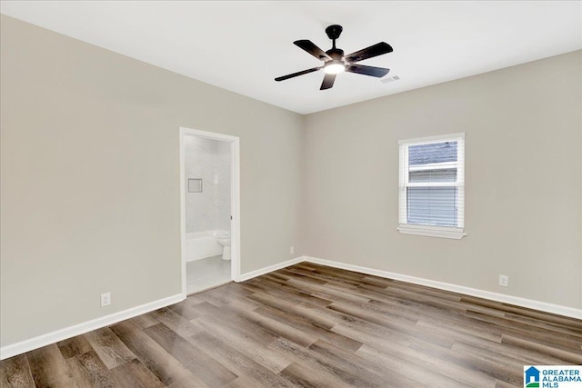 spare room featuring ceiling fan and hardwood / wood-style floors