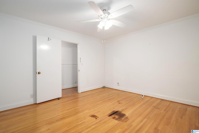 unfurnished room with light wood-type flooring, ceiling fan, and crown molding