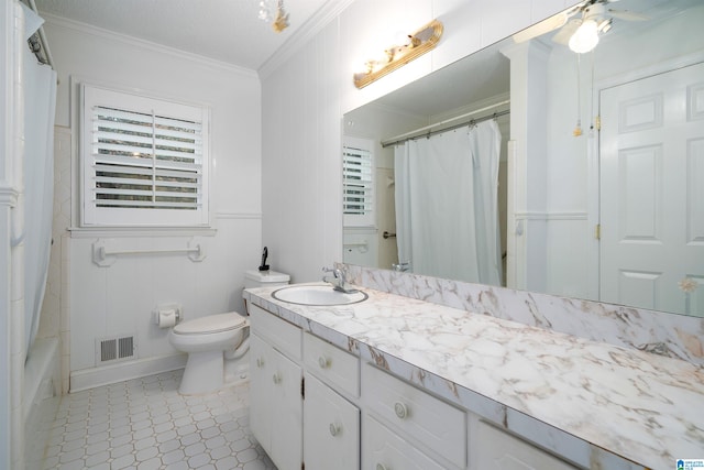 full bathroom with tile patterned floors, ornamental molding, vanity, ceiling fan, and toilet