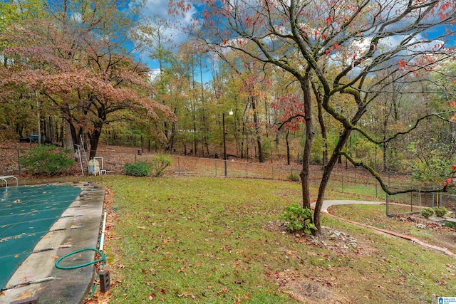 view of yard with basketball hoop