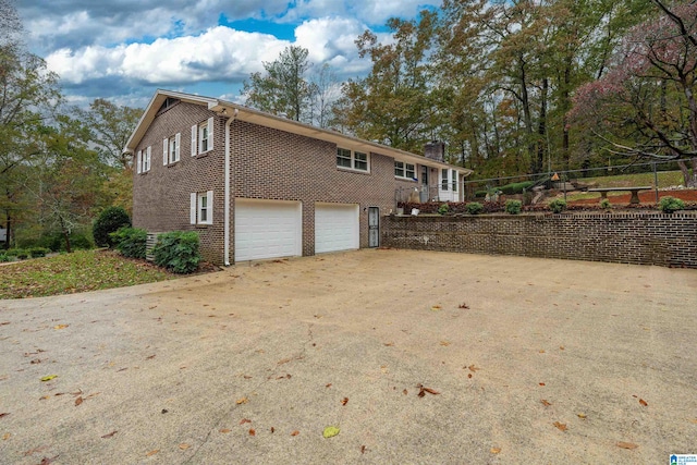 view of side of home with a garage