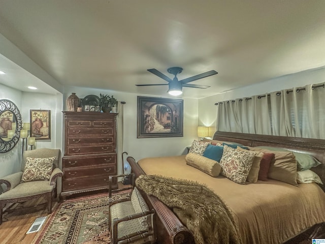 bedroom featuring wood finished floors and ceiling fan