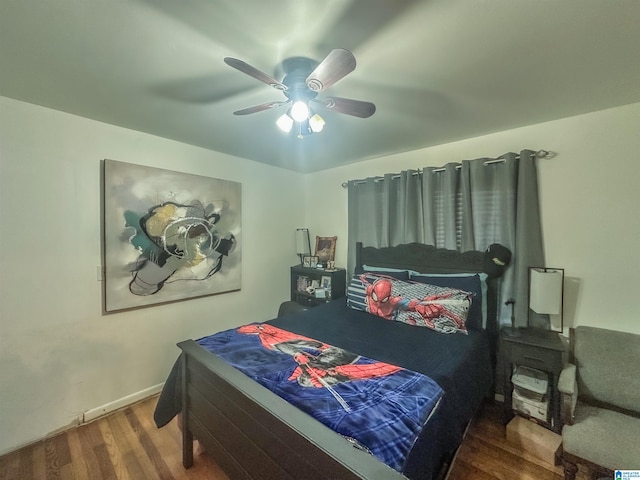 bedroom featuring ceiling fan and wood finished floors