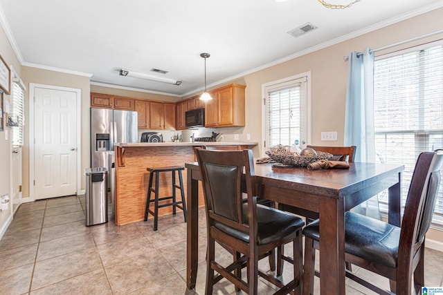 tiled dining area with ornamental molding