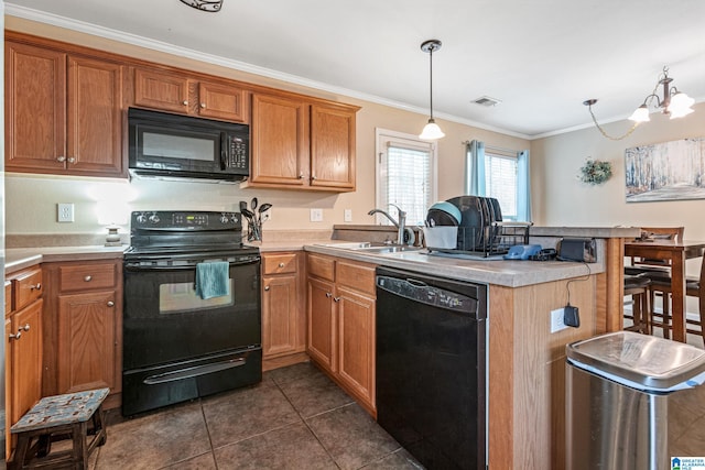 kitchen featuring kitchen peninsula, ornamental molding, black appliances, decorative light fixtures, and a notable chandelier