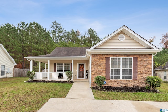 view of front of house with a porch and a front yard