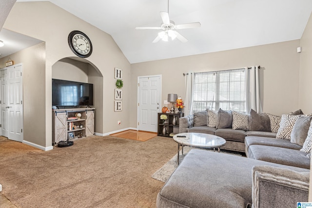 carpeted living room featuring high vaulted ceiling and ceiling fan