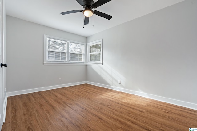 unfurnished room with hardwood / wood-style floors and ceiling fan