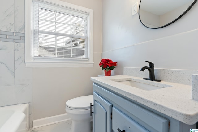 bathroom with vanity and toilet