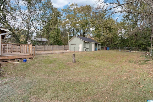 view of yard with an outbuilding and a wooden deck