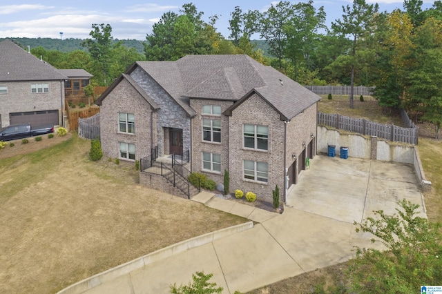 view of front of house with a front lawn and a garage