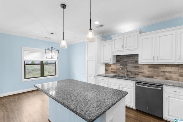 kitchen featuring dishwasher, a kitchen island, white cabinetry, and sink