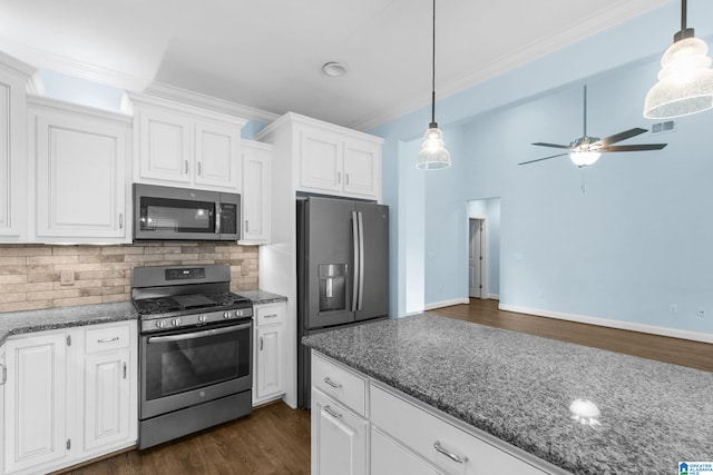 kitchen featuring decorative light fixtures, dark hardwood / wood-style flooring, white cabinetry, and stainless steel appliances