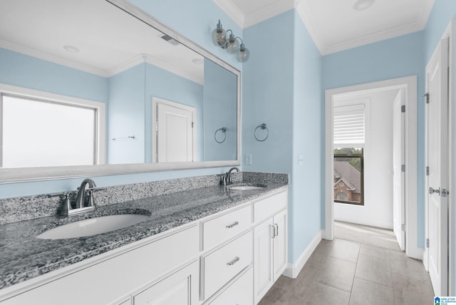 bathroom with tile patterned floors, vanity, and crown molding