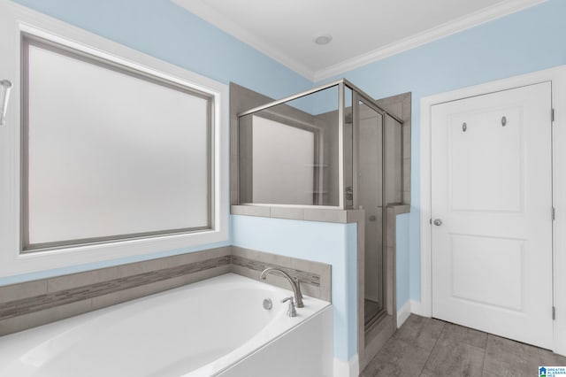 bathroom featuring crown molding and independent shower and bath