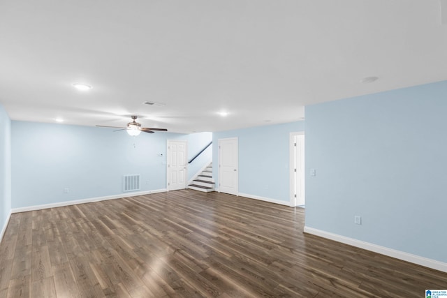 interior space with ceiling fan and dark wood-type flooring