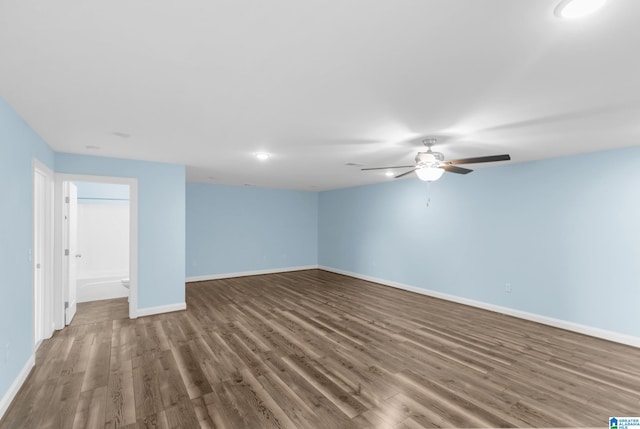 unfurnished room with ceiling fan and wood-type flooring