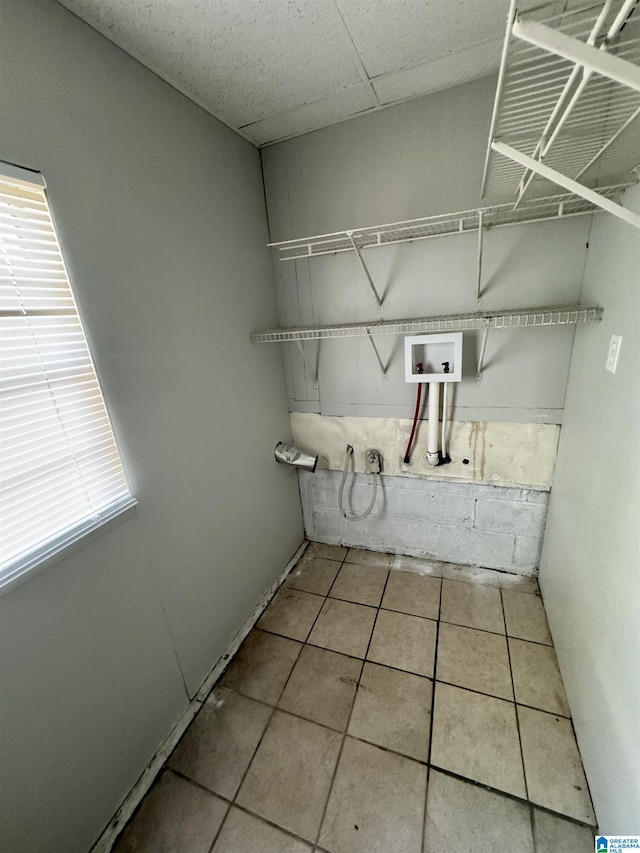 clothes washing area with washer hookup and tile patterned floors