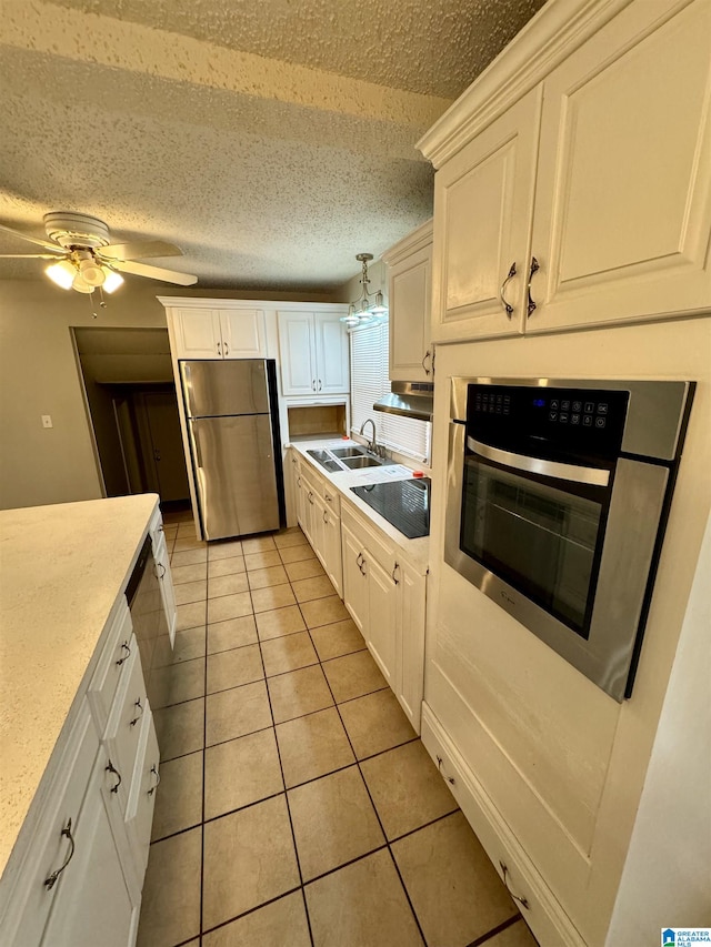 kitchen featuring sink, white cabinetry, and stainless steel appliances