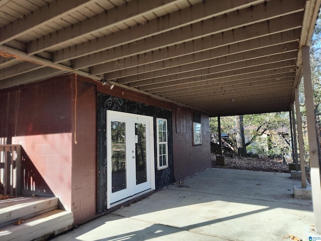 view of patio / terrace with a carport and french doors