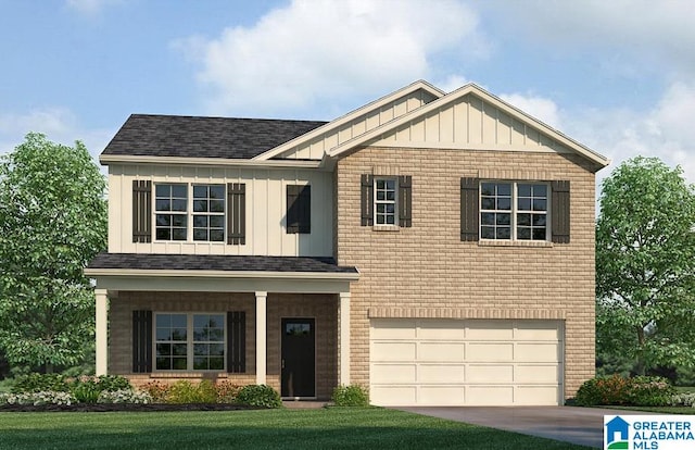 craftsman inspired home featuring a front yard and a garage