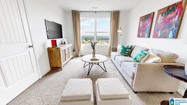 living room with light colored carpet