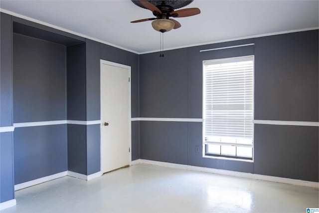 empty room featuring concrete flooring and ceiling fan