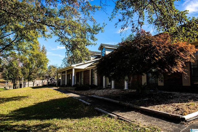 view of home's exterior featuring a lawn